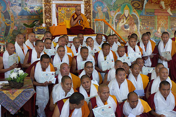 His Holiness the Dalai Lama with some of the monks who received their Geshe Lharampa certificates at the start of his third day of teachings at Sera Jey Monastery in Bylakuppe, Karnataka, India on December 27, 2013. Photo/Jeremy Russell/OHHDL 