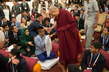 His Holiness the Dalai Lama greeting students as he arrives at their interactive meeting in New Deli, India on March 20, 2015. Photo/Tenzin Choejor/OHHDL