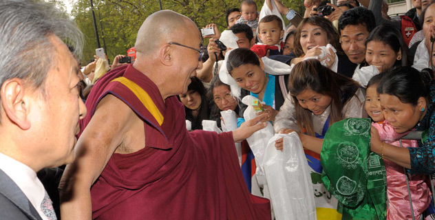 His Holiness the Dalai Lama greeting well-wishers on his arrival at his hotel in London, UK, on May 13, 2012.