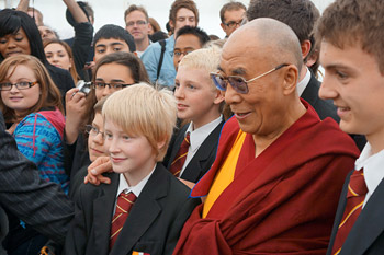 His Holiness the Dalai Lama poses for photos with a group of students after their  conversation in Leeds, England, on June 15, 2012. Photo/Jeremy Russell/OHHDL 