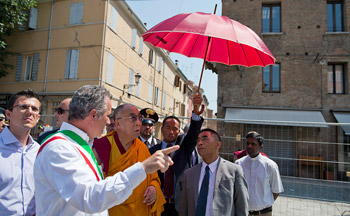 His Holiness the Dalai Lama is escorted through earthquake affected areas of Mirandola, Italy, on June 24, 2012. Photo/Tenzin Choejor/OHHDL
