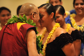 His Holiness the Dalai Lama does a traditional Hawaiian Ha with a student during welcoming ceremonies on his arrival in Honolulu, Hawaii, on April 13, 2012. Photo/JHook/Civic Beat