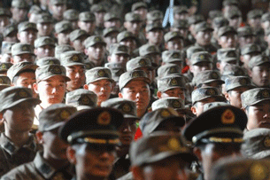 Young military recruits gather for a ceremony in Beijing prior to their departure for Tibet, Nov. 20, 2011/AFP Photo