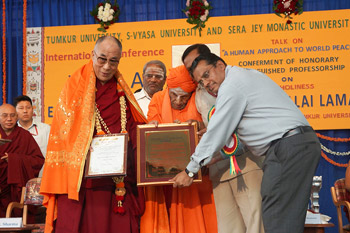 His Holiness the Dalai Lama is presented with an Honorary Distinguished Professorship from Timkur University in Bangalore, India, on November 27, 2012. Photo/Jeremy Russell/OHHDL