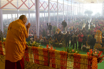 His Holiness the Dalai Lama acknowledging the audience on his arrival for the third day of his teachings in Sarnath, Uttar Pradesh, India, on January 9, 2013. Photo/Tenzin Choejor/OHHDL