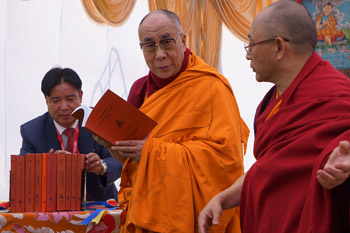 His Holiness the Dalai Lama with Ven Prof Ngawang Samten releasing new books published by the Central University for Tibetan Studies in Sarnath, Uttar Pradesh, India, on January 11, 2013. Photo/Jeremy Russell/OHHDL