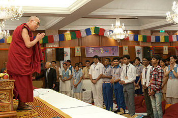 His Holiness the Dalai Lama greeting class students before their interactive session in New Delhi, India, on March 22, 2013. Photo/Tenzin Phuntsog/NAVA