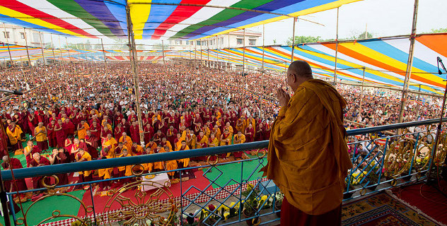 His Holiness the Dalai Lama acknowledging the crowd gathered to here his teachings in Salugara, West Bengal. Photo/Tenzin Choejor/OHHDL