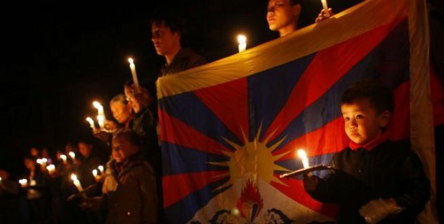 Exile Tibetans participate in a candle light vigil in solidarity with fellow Tibetans who have self immolated, in Katmandu, Nepal/AP