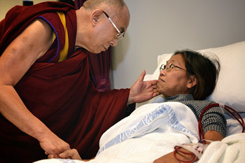 His Holiness the Dalai Lama comforts a patient during his visit to Westmead Hospital in Sydney, Australia on June 17, 2013. Photo/Rusty Stewart/DLIA 2013