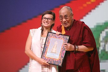 His Holiness the Dalai Lama presenting Tereze Telpe with the Dalai Lama Award for Youth Compassion at the start of his talk in Riga, Latvia on September 9, 2013. Photo/Igor/SaveTibetRussia