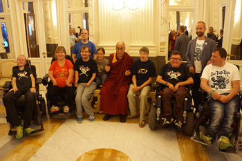 His Holiness the Dalai Lama with a group of physically challenged young people who play music together on his arrival at the Tipsport Arena before the start of his talk in Prague, Czech Republic on September 14, 2013. Photo/Jeremy Russell/OHHDL