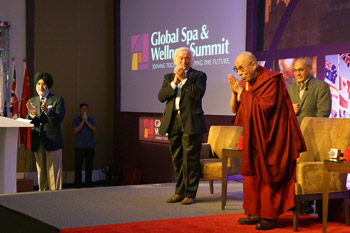 His Holiness the Dalai Lama greeting the audience at the start of his talk at the the Global Spa and Wellness Summit in Guragon, India on October 6, 2013. Photo/Jeremy Russell/OHHDL