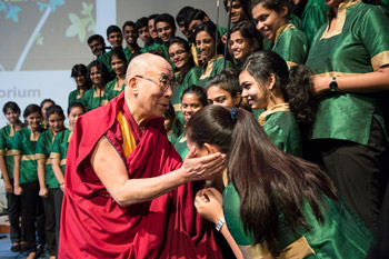 His Holiness the Dalai Lama greeting members of the Christ University Choir after their performance at the start of the conference on "Bounds of Ethics in a Globalized World" at Christ University in Bangalore, India on January 6, 2014. Photo/Tenzin Choejor/OHHDL