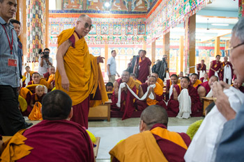 His Holiness the Dalai Lama greeting the gathering as he arrives at the Sera Lachi Temple at Sera Monastery in Bylakuppe, Karnataka, India on December 24, 2013. Photo/Tenzin Choejor/OHHDL