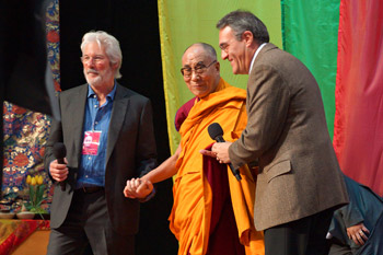 His Holiness the Dalai Lama is accompanied by actor Richard Gere as he arrives on stage at the Arena Ciudad de Mexico at the start of his teachings in Mexico City, Mexico on October 12, 2013. Photo/Jeremy Russell/OHHDL