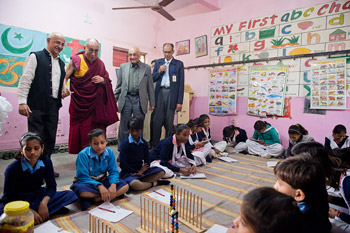 Harsh Mander and His Holiness the Dalai Lama visiting a classroom at the Care Home for Street Children in Mehrauli, New Delhi, India on December 7, 2013. Photo/Tenzin Choejor/OHHDL
