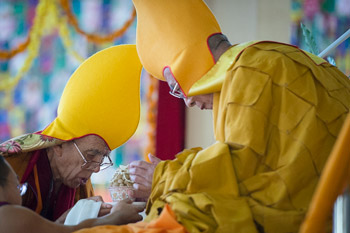 Ganden Tripa Rizong Rinpoche making traditional offerings at the start of His Holiness the Dalai Lama's final day of teachings at Sera Jey Monastery in Bylakuppe, Karnataka, India on January 3, 2014. Photo/Tenzin Choejor/OHHDL