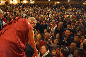 His Holiness the Dalai Lama shaking hands with members of the audience at the conclusion of his talk at the Beacon Theater in New York on October 20, 2013. Photo/Jeremy Russell/OHHDL