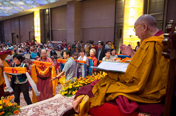 Some of the many Mongolians with offerings for His Holiness the Dalai Lama during Long Life prayers on the last day of his three day teachings for Mongolian Buddhists in New Delhi, India on December 4, 2013. Photo/Tenzin Choejor/OHHDL