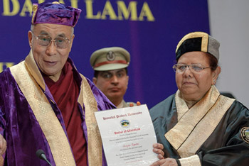 Himachal Pradesh Governor Urmila Singh presenting His Holiness the Dalai Lama with an honorary degree from Himachal Pradesh University in Shimla, India on March 19, 2014. Photo/Tenzin Choejor/OHHDL