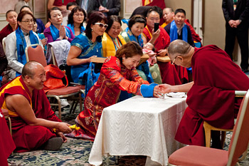 A member of a group from Mongolia presenting an offering to His Holiness the Dalai Lama during his last day in Tokyo, Japan on April 18, 2014. Photo/Office of Tibet, Japan