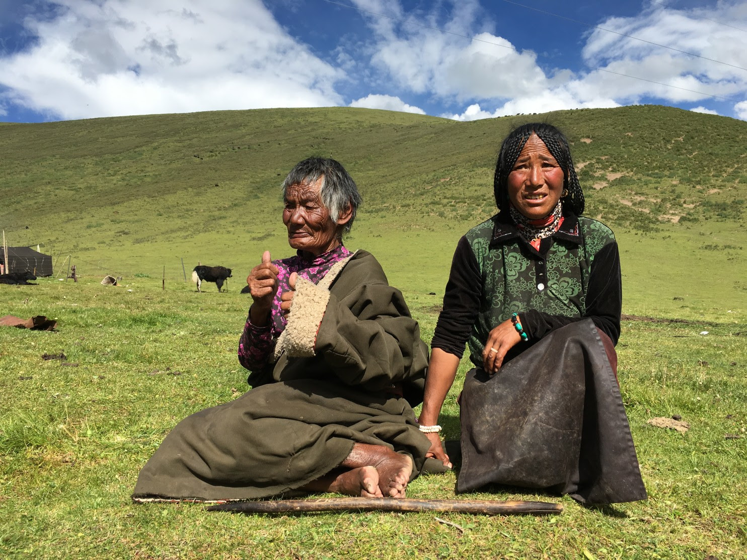 Tsering Tso’s grandmother, Lhadhey, 83, and mother, Adhey, 49, on the grasslands outside the small town of Chalong in China’s western Sichuan province. Last October, Tibetans protested in Chalong after 27-year-old Tsering Tso was found hanged from a bridge in the town, prompting mass arrests, beatings and a government crackdown. (Xu Yangjingjing/The Washington Post). (Xu Yangjingjing/TWP)